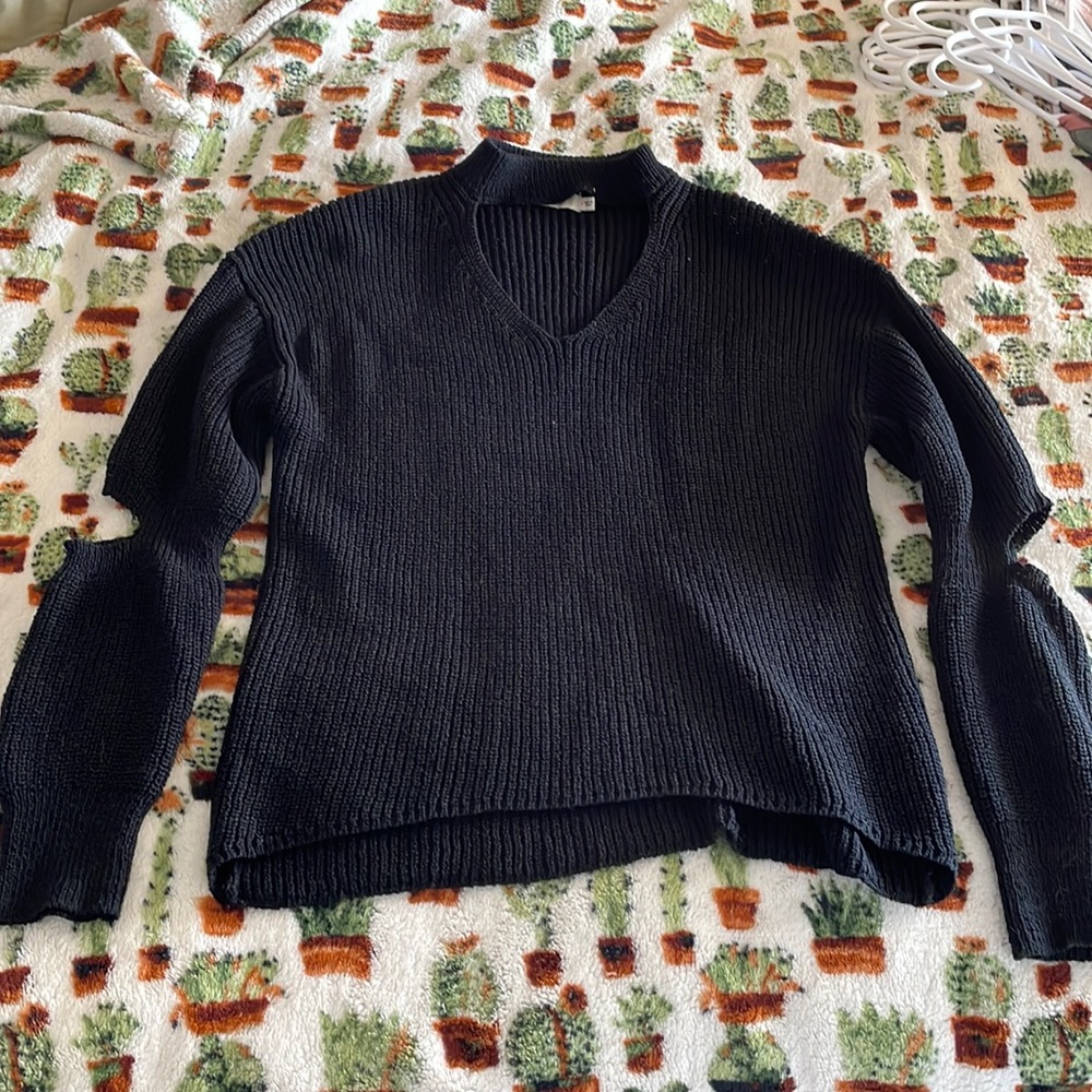 Cute sweater from a boutique. Open elbow design.